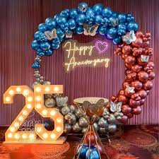 25th Anniversary Modern Balloon Arch Decor In Blue And Rose Gold With Neon Sign