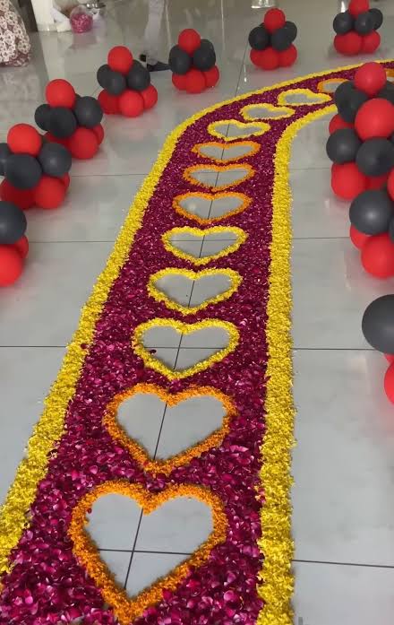 Romantic Anniversary Walkway With Red And Yellow Petal Hearts And Balloon Clusters