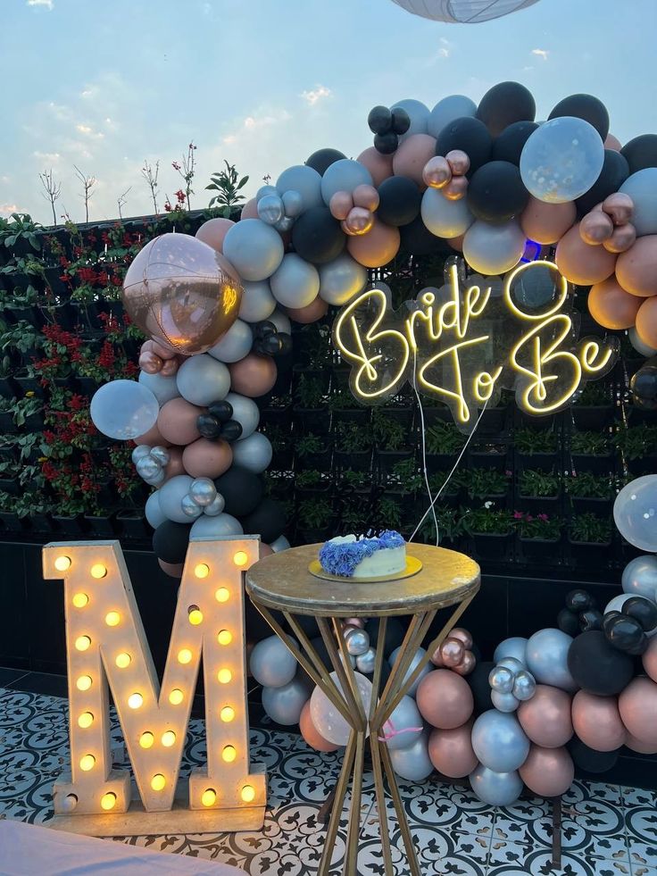 Modern Bride To Be Balloon Arch Decor In Black And Rose Gold With Neon Sign For Bridal Shower